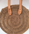 Round straw beach tote bag