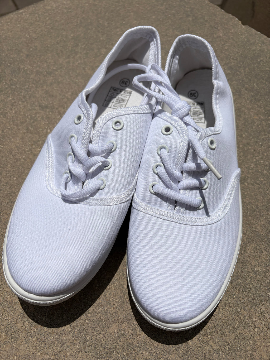 White canvas plimsolls