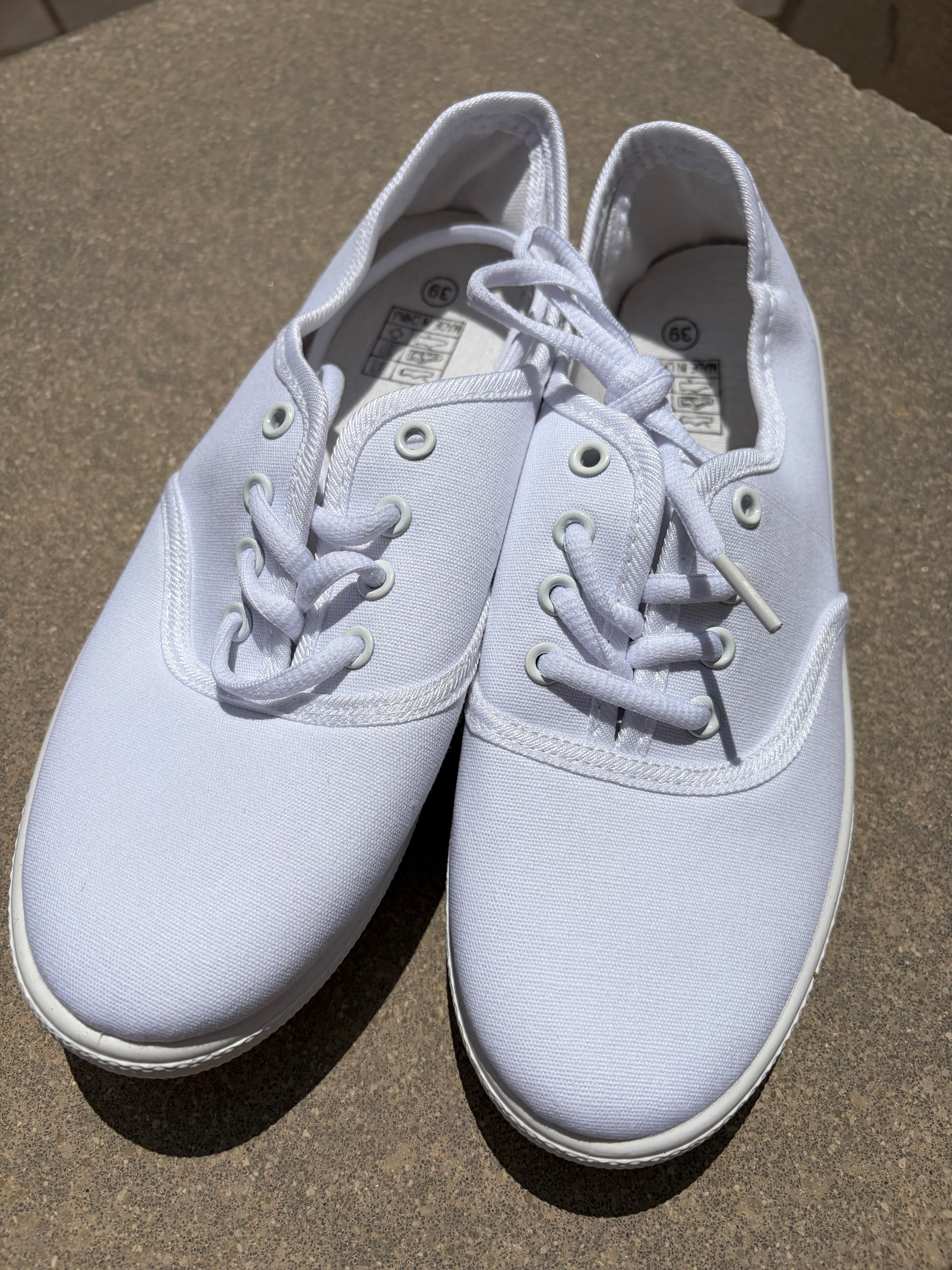 White canvas plimsolls