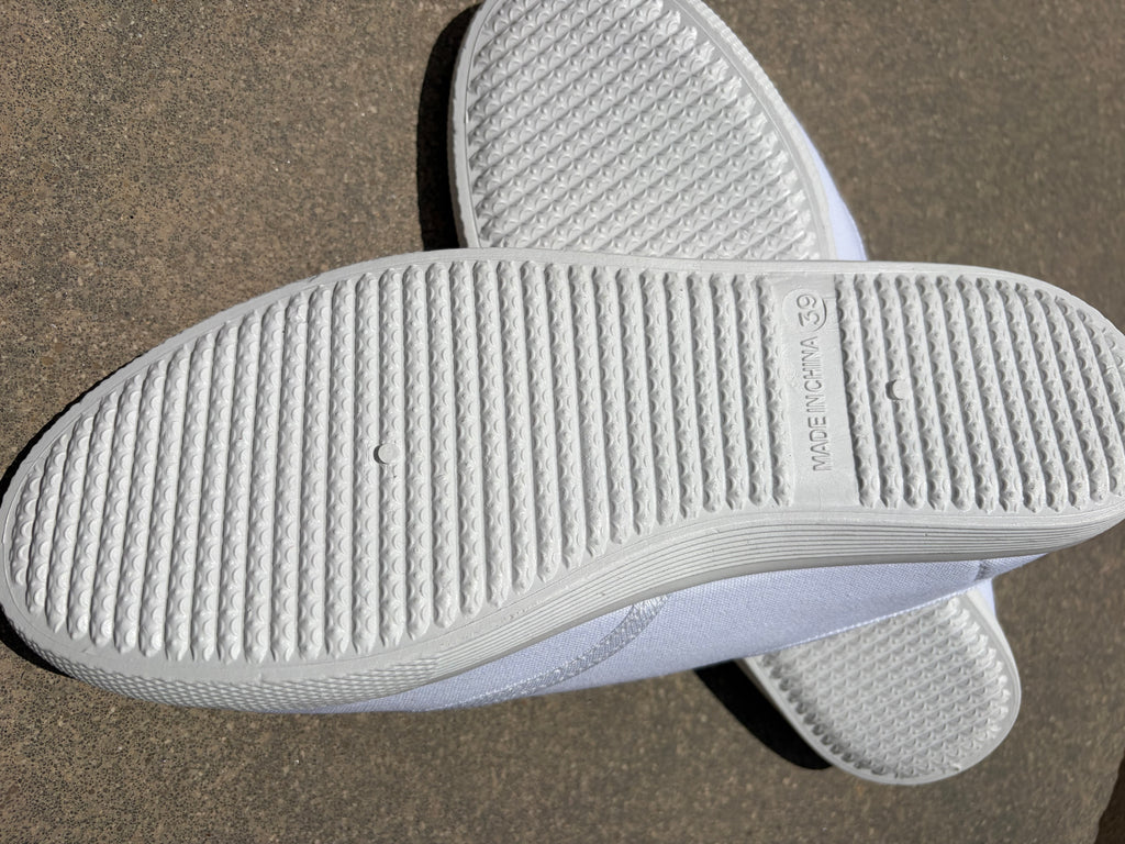 White canvas plimsolls