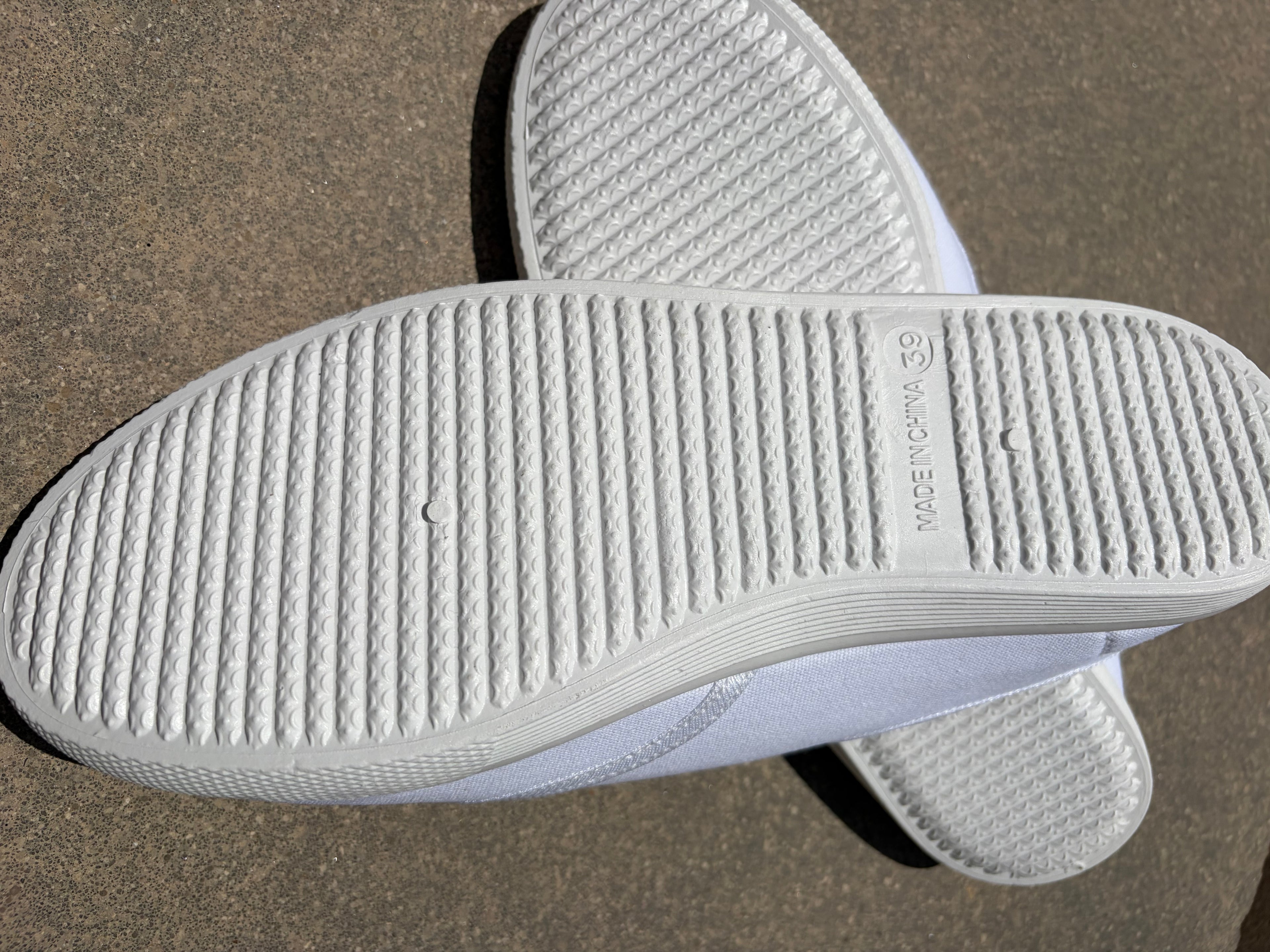 White canvas plimsolls